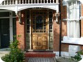 Stripped front door and surround. The door has a different colour due to priming with warm raw linseed oil which acts as a  primer/preservative/mould inhibitor and sealer for the ensuing coats of linseed paint.